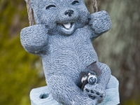 Happy bear swinging